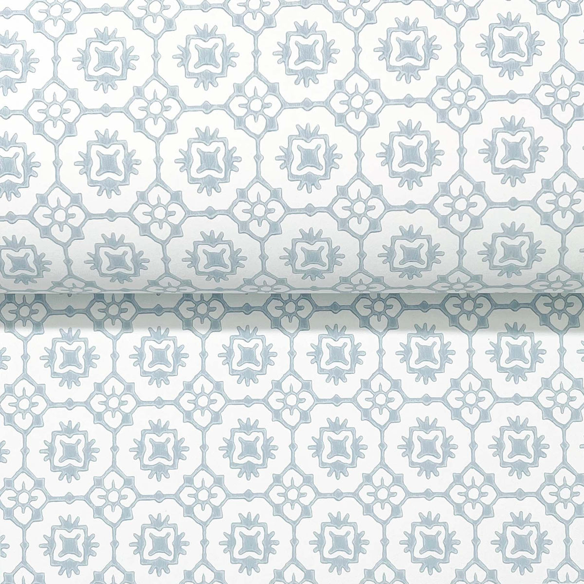 Priti Floral Grid Wallpaper by York Wallcoverings features a repeating geometric floral pattern in soft light blue and white, showcasing symmetrical shapes and muted tones.