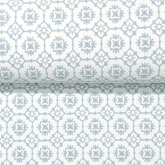 Priti Floral Grid Wallpaper by York Wallcoverings features a repeating geometric floral pattern in soft light blue and white, showcasing symmetrical shapes and muted tones.