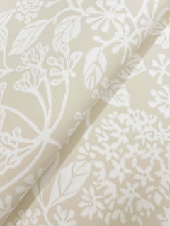 Introducing Rowen Botanical Wallpaper by York Wallcoverings—a cream-colored wallpaper showcasing an embossed white floral and leaf pattern with intricate stems, blossoms, and overlapping designs. Soft shadows add depth, beautifully enhancing its textured effect.
