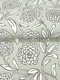 Chatsworth Garden Floral Trail Wallpaper by York Wallcoverings features a light green background with a bold black and white floral pattern of large blooming flowers and leaves. The striking design is characterized by thick outlines and repeats seamlessly across the surface.