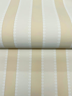 The Tilford Awning Stripe Wallpaper by York Wallcoverings features cream and beige stripes with alternating wide bands and narrow white patterned lines. The subtle sheen on the stripes adds a refined touch, and the partially unrolled roll showcases the elegant repeating design.