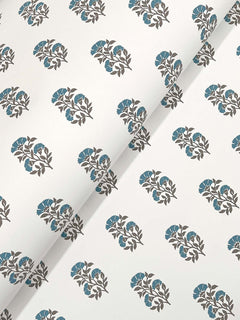 Sylvie Floral Wallpaper by York Wallcoverings features a white background with a repeating pattern of small, stylized floral bouquets showcasing blue flowers and gray leaves, arranged in evenly spaced rows. The image depicts the wallpaper partially rolled out at an angle.