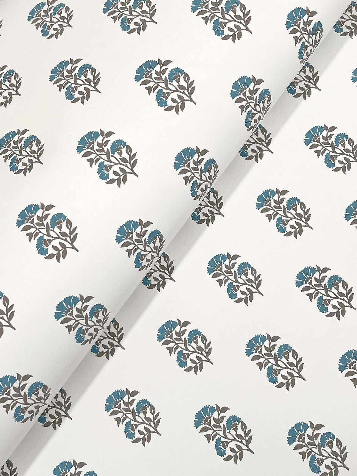 Sylvie Floral Wallpaper by York Wallcoverings features a white background adorned with repeating diagonal rows of blue flowers and dark gray leaves.