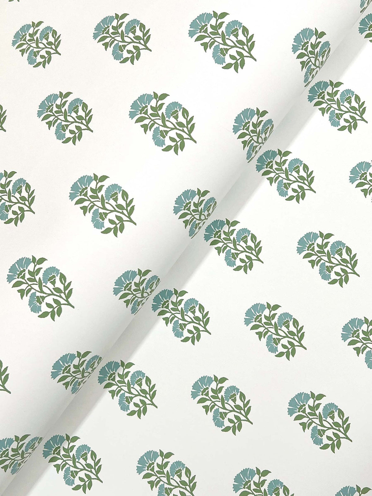 The Sylvie Floral Wallpaper by York Wallcoverings features a white background adorned with evenly spaced diagonal clusters of green stems and blue flowers.