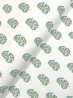 The Sylvie Floral Wallpaper by York Wallcoverings features a white background adorned with evenly spaced diagonal clusters of green stems and blue flowers.