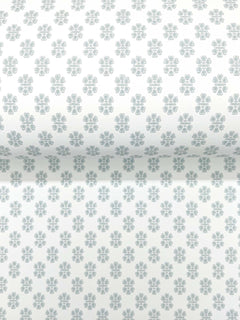 The Brioni Floral Stamp Wallpaper by York Wallcoverings features a roll of white wallpaper adorned with a repeating pattern of small, light gray, four-petal floral shapes.
