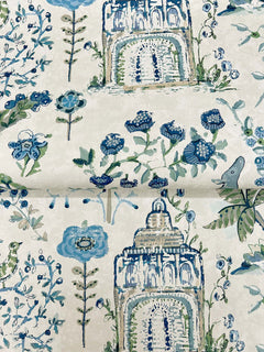 Parc Garden Dreams Wallpaper by York Wallcoverings features a light background adorned with whimsical, hand-painted motifs of blue and green florals, leafy branches, birds, and illustrated archways or towers.
