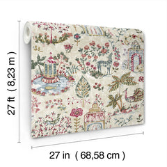 A roll of York Wallcoverings’ “Parc Garden Dreams Wallpaper,” measuring 27 feet by 27 inches (68.58 cm), is displayed upright, featuring colorful patterns of birds, flowers, trees, and deer on a cream background.