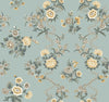 The Genevieve Floral Trail Wallpaper by York Wallcoverings showcases a seamless pattern of vintage yellow and white flowers with green leaves, intricately and symmetrically arranged on a light blue background.