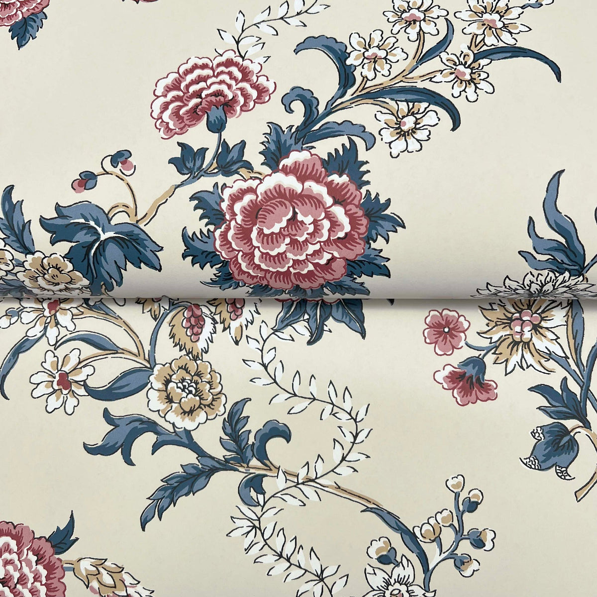 Genevieve Floral Trail Wallpaper by York Wallcoverings features a cream-colored background adorned with an intricate vintage floral pattern of large pink and red peonies, blue leaves, and small yellow and white flowers in a repeating design.