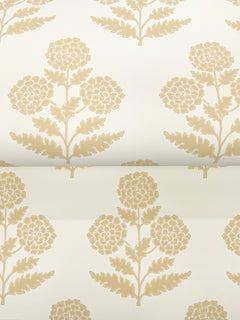 The Souci Marigolds Wallpaper by York Wallcoverings features a beige floral pattern with stylized flowers and leaves, repeated symmetrically and evenly spaced on a light cream background for a classic, elegant look.